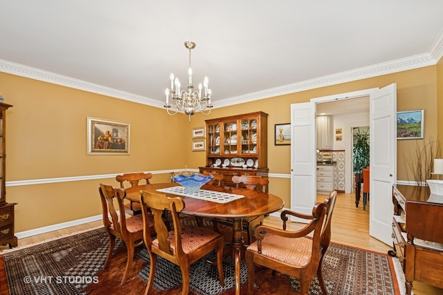 20830 W Exeter Rd, Kildeer, IL 60047 - dining area featuring a chandelier, light wood-style flooring, and crown molding
