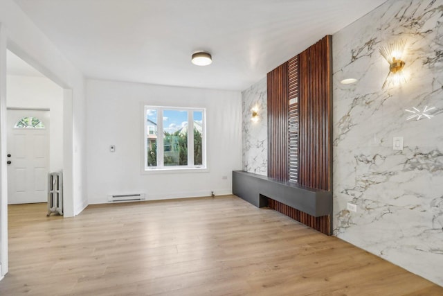 5048 W Superior St, Chicago, IL 60644 - foyer featuring baseboard heating, radiator, and wood finished floors
