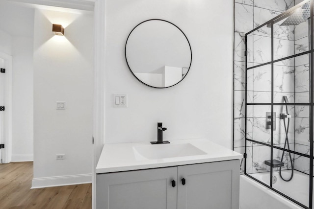 5048 W Superior St, Chicago, IL 60644 - full bathroom with vanity, enclosed tub / shower combo, and wood finished floors