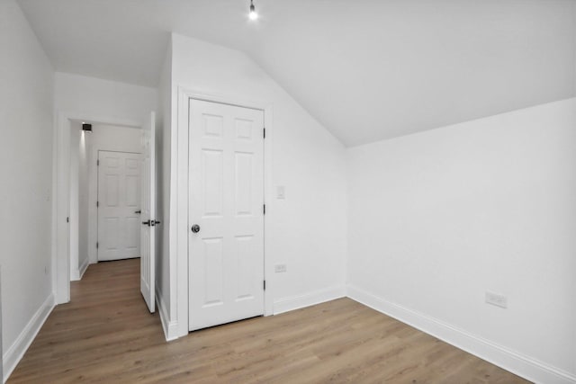 5048 W Superior St, Chicago, IL 60644 - bonus room featuring light wood finished floors and vaulted ceiling