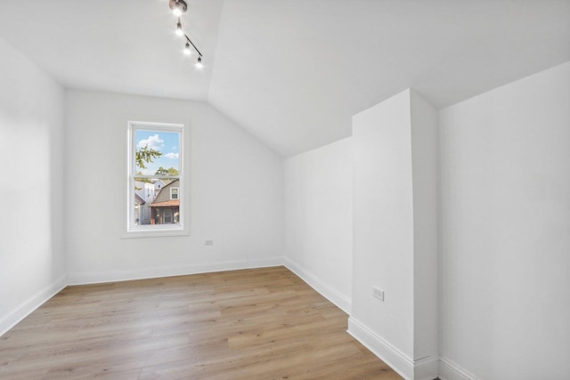 5048 W Superior St, Chicago, IL 60644 - additional living space with light wood-type flooring and vaulted ceiling