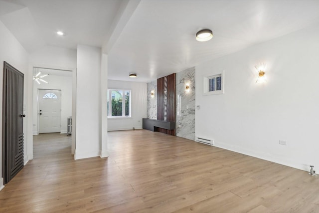 5048 W Superior St, Chicago, IL 60644 - unfurnished living room with wood finished floors and baseboards