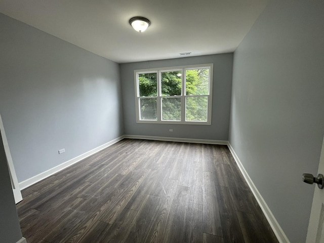 7948 S Union Ave, Chicago, IL 60620 - empty room featuring dark wood-type flooring and baseboards