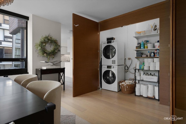 1410 N State Pkwy Unit 5B, Chicago, IL 60610 - washroom with stacked washer / dryer and light wood finished floors