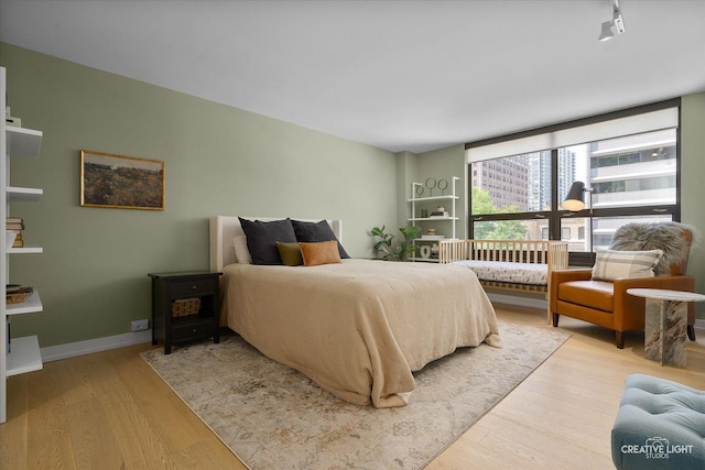 1410 N State Pkwy Unit 5B, Chicago, IL 60610 - bedroom featuring wood finished floors and baseboards
