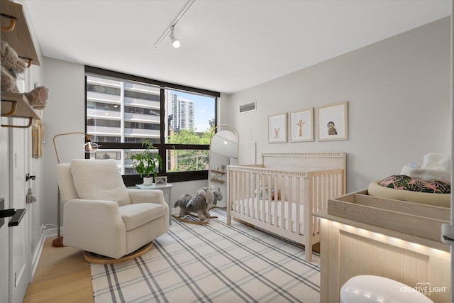 1410 N State Pkwy Unit 5B, Chicago, IL 60610 - bedroom featuring track lighting and light wood-type flooring