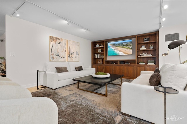 1410 N State Pkwy Unit 5B, Chicago, IL 60610 - living room with track lighting, built in features, and wood finished floors