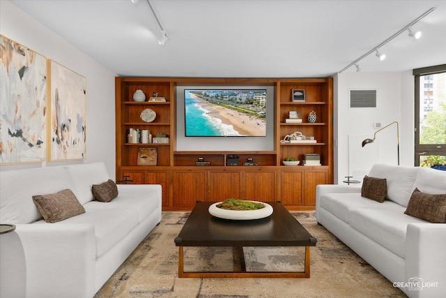 1410 N State Pkwy Unit 5B, Chicago, IL 60610 - living room featuring track lighting and built in shelves
