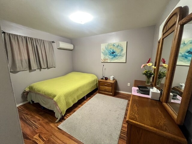 1313 Loral Ave, Joliet, IL 60435 - bedroom with wood finished floors and a wall mounted air conditioner