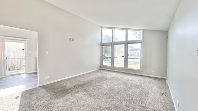 619 E 152nd St, Dolton, IL 60419 - carpeted spare room featuring healthy amount of natural light and high vaulted ceiling