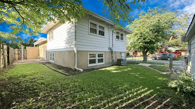 619 E 152nd St, Dolton, IL 60419 - rear view of property with a fenced backyard and brick siding