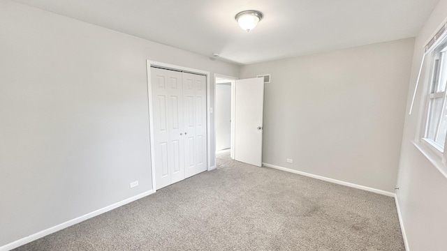 619 E 152nd St, Dolton, IL 60419 - unfurnished bedroom featuring carpet floors and a closet
