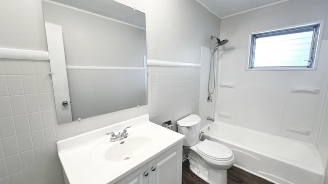 619 E 152nd St, Dolton, IL 60419 - bathroom featuring tile walls, vanity, shower / tub combination, and wood finished floors