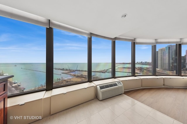 505 N Lake Shore Dr Unit 2110-11, Chicago, IL 60611 - unfurnished sunroom with a wall mounted air conditioner and a water view