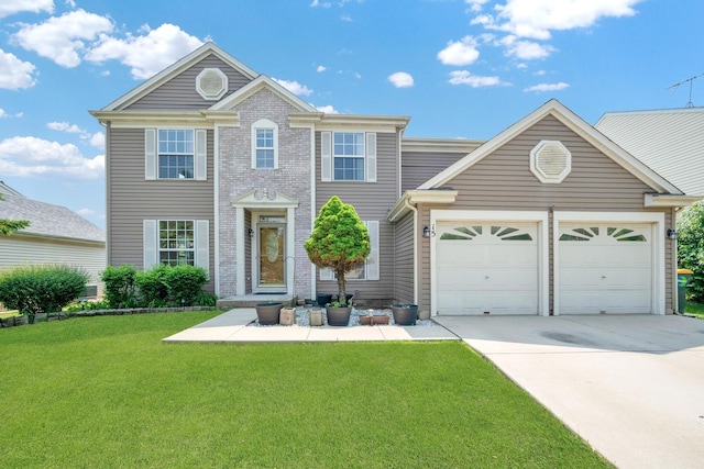 15 Harrison Ln, Streamwood, IL 60107 - view of front of house featuring concrete driveway, a garage, and a front yard