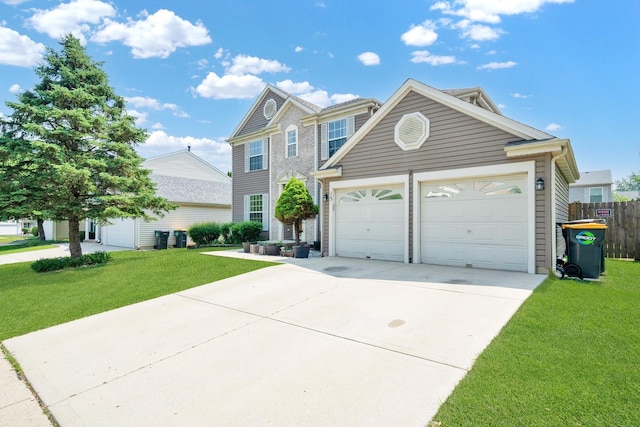15 Harrison Ln, Streamwood, IL 60107 - view of front facade with concrete driveway and an attached garage