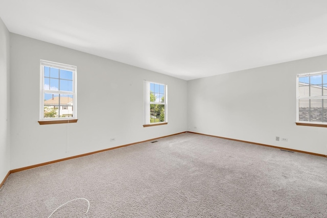 15 Harrison Ln, Streamwood, IL 60107 - spare room featuring healthy amount of natural light and carpet floors