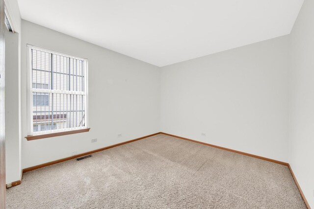 15 Harrison Ln, Streamwood, IL 60107 - unfurnished room with carpet flooring