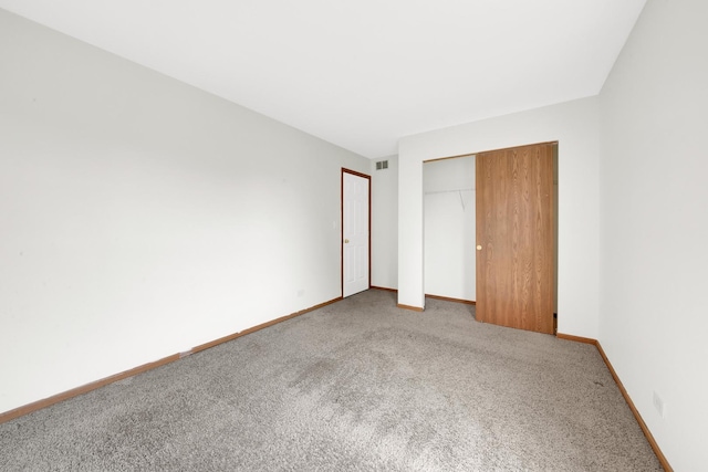 15 Harrison Ln, Streamwood, IL 60107 - unfurnished bedroom featuring carpet floors and a closet