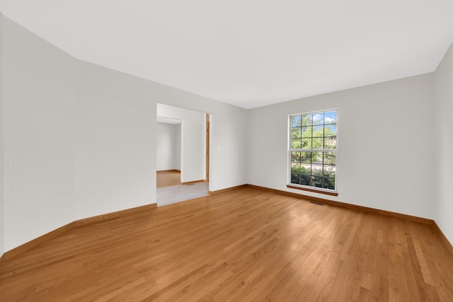 15 Harrison Ln, Streamwood, IL 60107 - unfurnished room featuring light wood-style floors and baseboards