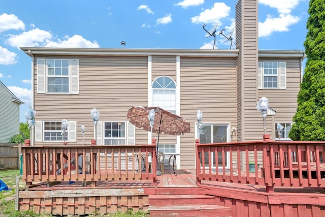 15 Harrison Ln, Streamwood, IL 60107 - back of property with a deck and a chimney