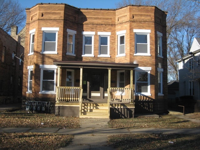 203 Union St, Joliet, IL 60433 - view of front of home featuring a porch and brick siding