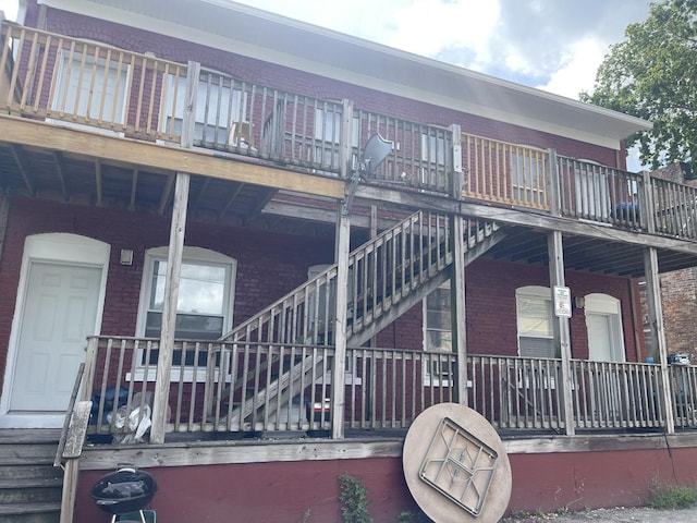 203 Union St, Joliet, IL 60433 - view of side of home with brick siding and stairs