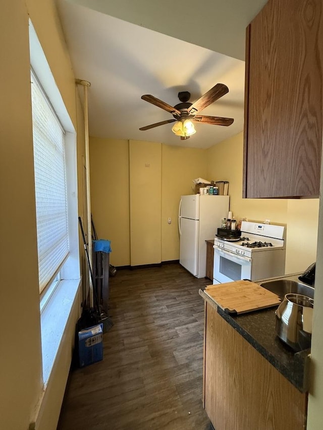 203 Union St, Joliet, IL 60433 - kitchen with white appliances, ceiling fan, dark wood finished floors, and dark countertops