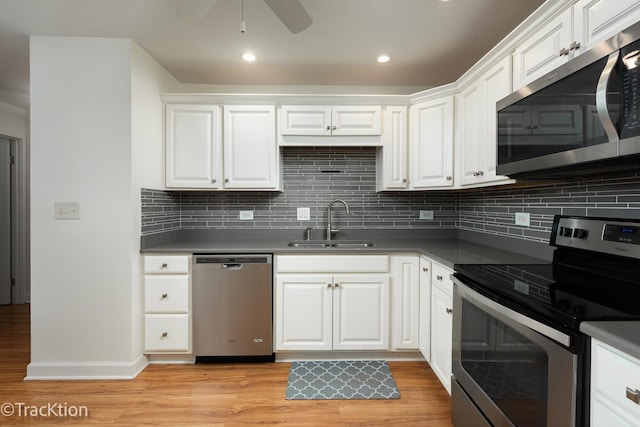 7515 Nantucket Dr Unit 202, Darien, IL 60561 - kitchen with stainless steel appliances, light wood-type flooring, white cabinets, a ceiling fan, and recessed lighting
