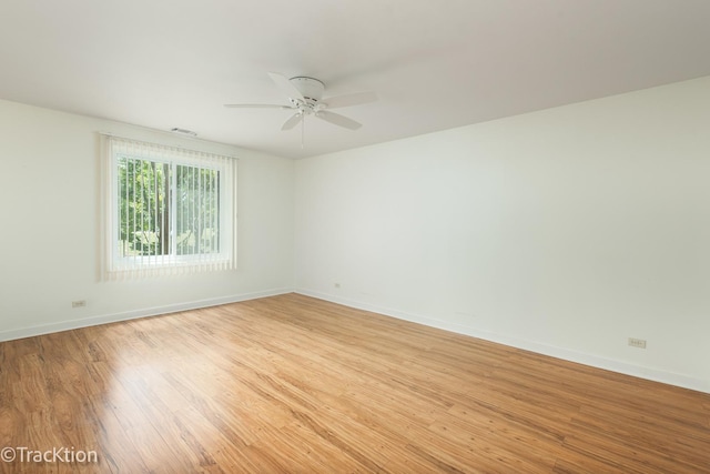 7515 Nantucket Dr Unit 202, Darien, IL 60561 - spare room with light wood-style flooring and a ceiling fan