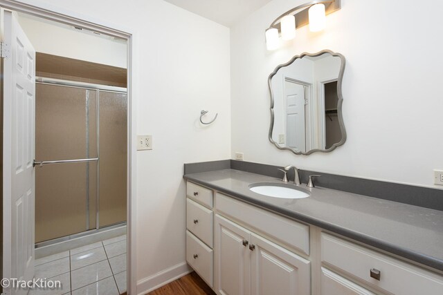 7515 Nantucket Dr Unit 202, Darien, IL 60561 - bathroom featuring vanity and a stall shower