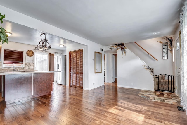 7912 S 85th Ave, Justice, IL 60458 - unfurnished living room with wood finished floors and stairway