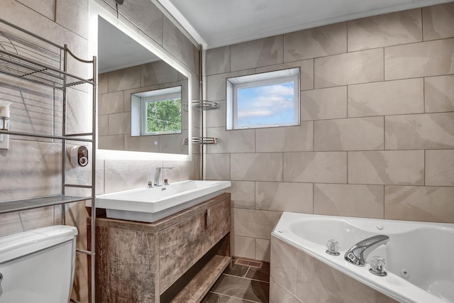 7912 S 85th Ave, Justice, IL 60458 - bathroom with tile walls, a whirlpool tub, and vanity