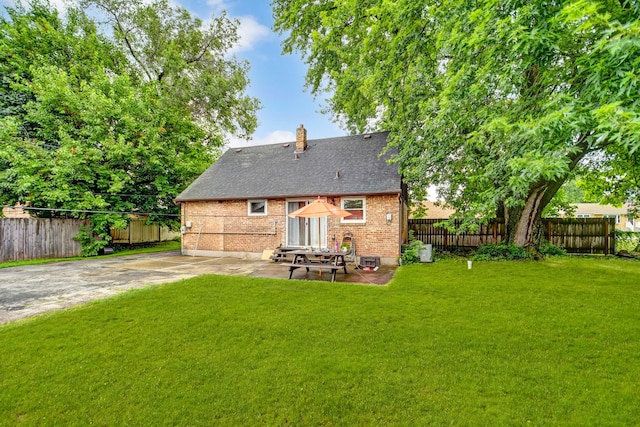 7912 S 85th Ave, Justice, IL 60458 - back of house featuring a chimney, a patio area, brick siding, entry steps, and roof with shingles