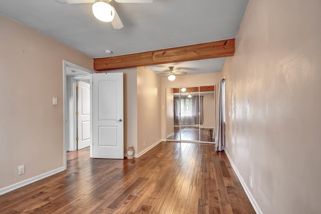 7912 S 85th Ave, Justice, IL 60458 - empty room with a ceiling fan, beamed ceiling, wood-type flooring, and a smoke detector