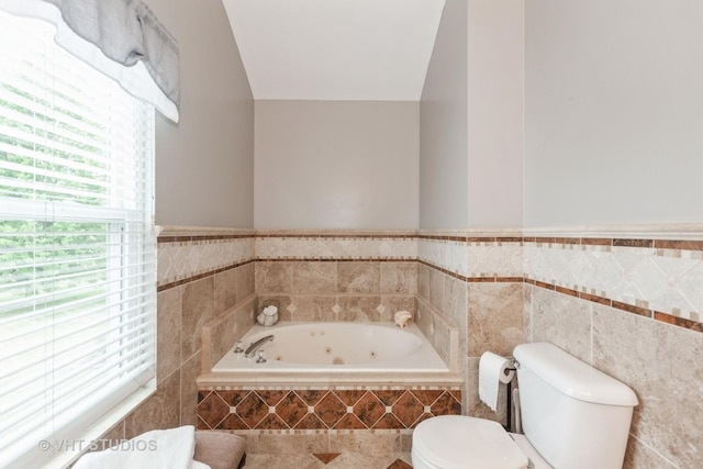 2578 Crestview Dr, Aurora, IL 60502 - bathroom featuring a whirlpool tub, a wainscoted wall, and tile walls