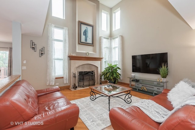 2578 Crestview Dr, Aurora, IL 60502 - living area with a towering ceiling, healthy amount of natural light, wood finished floors, and a fireplace