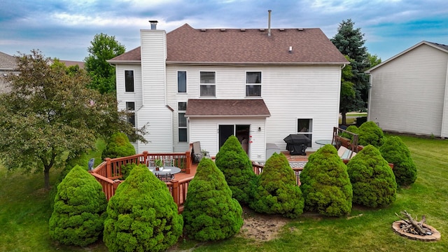 2578 Crestview Dr, Aurora, IL 60502 - back of house featuring a chimney, a deck, outdoor dining area, and roof with shingles
