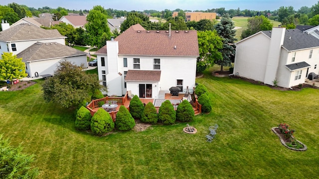 2578 Crestview Dr, Aurora, IL 60502 - rear view of house with a fire pit, a wooden deck, a lawn, a chimney, and a residential view