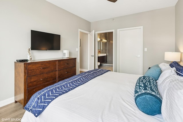 1101 S State St Unit 2202, Chicago, IL 60605 - bedroom featuring wood finished floors, ensuite bath, and ceiling fan