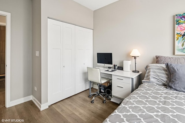 1101 S State St Unit 2202, Chicago, IL 60605 - bedroom with wood finished floors, a closet, and a desk