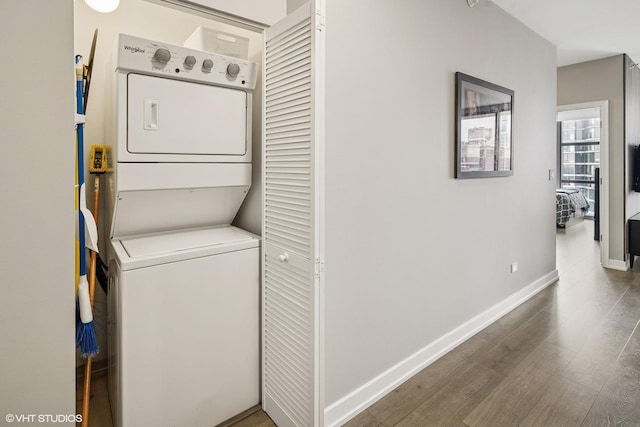 1101 S State St Unit 2202, Chicago, IL 60605 - washroom featuring stacked washer / dryer and wood finished floors