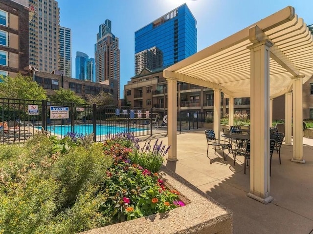 1101 S State St Unit 2202, Chicago, IL 60605 - community pool featuring a view of skyline and a patio area