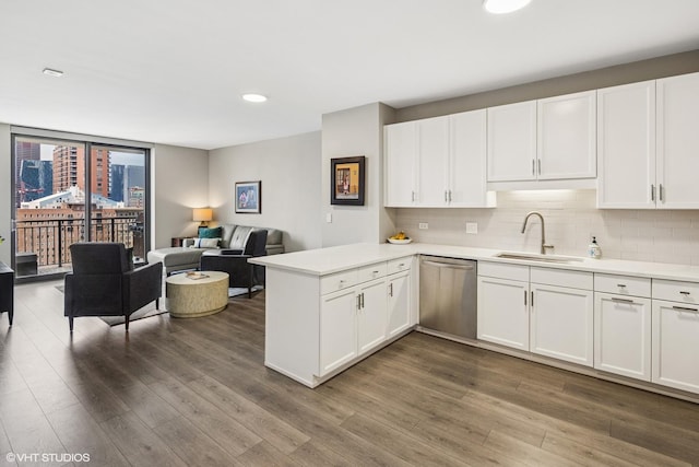1101 S State St Unit 2202, Chicago, IL 60605 - kitchen with stainless steel dishwasher, a peninsula, tasteful backsplash, white cabinetry, and recessed lighting