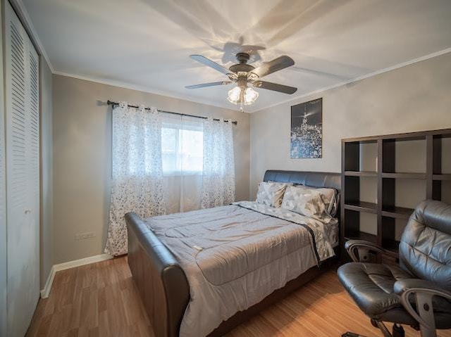 10109 S Cicero Ave Unit 302, Oak Lawn, IL 60453 - bedroom with wood finished floors, ornamental molding, and ceiling fan