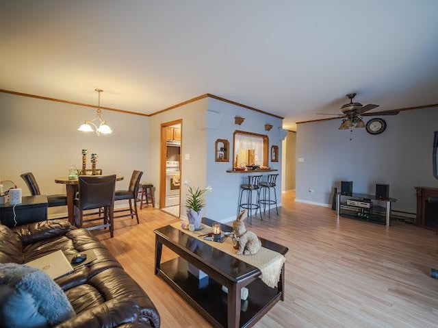 10109 S Cicero Ave Unit 302, Oak Lawn, IL 60453 - living room featuring ornamental molding, light wood-style flooring, ceiling fan, and a chandelier