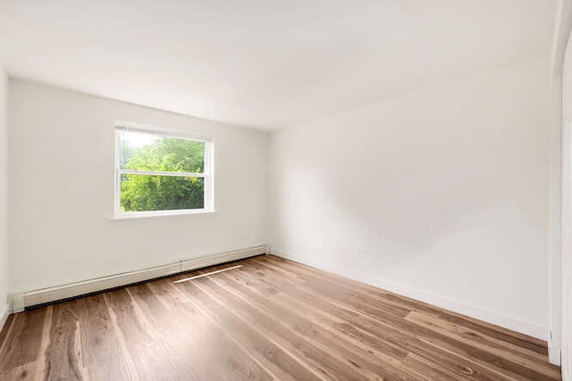 10130 S 84th Ter Unit 11107, Palos Hills, IL 60465 - unfurnished room with baseboard heating and wood finished floors