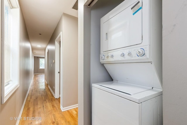 3115 W Lexington St, Chicago, IL 60612 - washroom featuring stacked washing machine and dryer and light wood-style floors