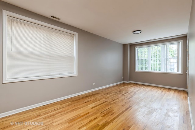 3115 W Lexington St, Chicago, IL 60612 - unfurnished room with wood finished floors and baseboards