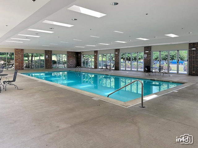 614 Pineridge Dr N Unit 614, Oswego, IL 60543 - indoor community pool featuring a skylight